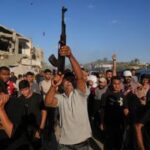 Renewed fighting tests Gaza ceasefire; Israel briefly halts aid