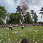 WATCH: Woman rescues toddler moments before hundreds of Easter eggs drop
